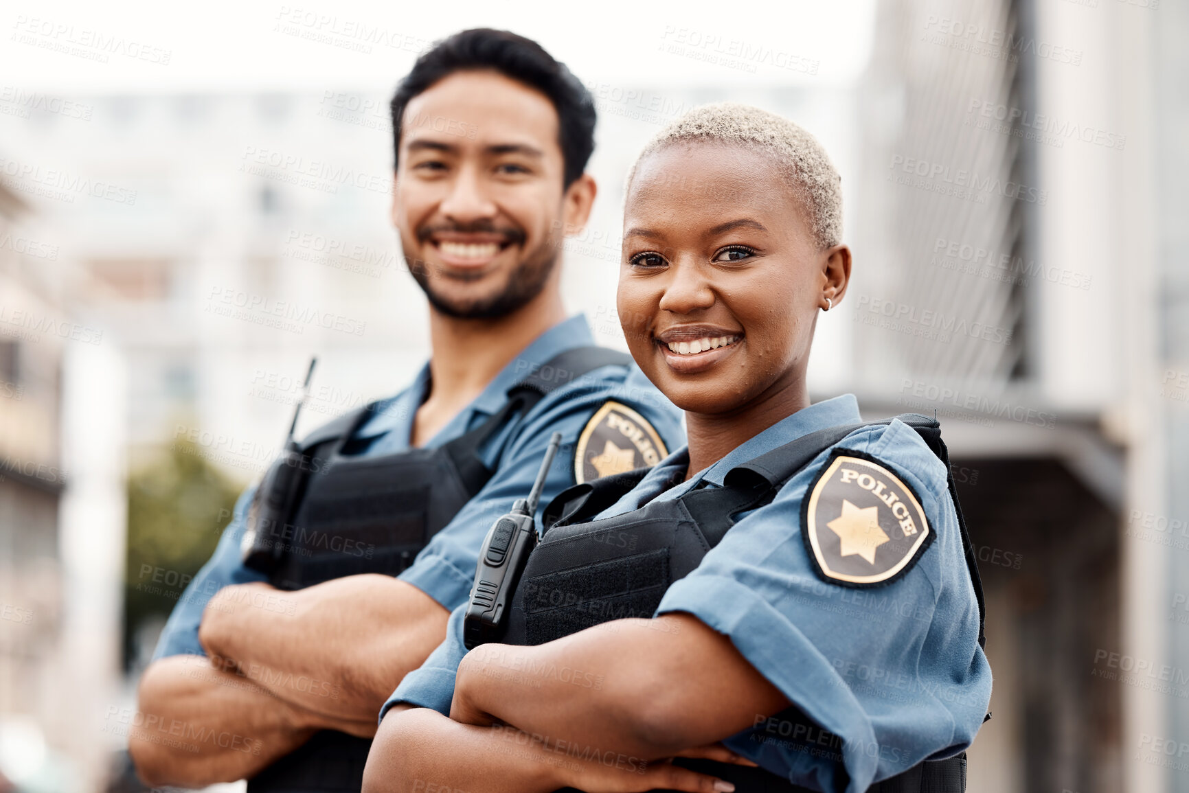 Buy stock photo Happy police, team and arms crossed in confidence for city protection, law enforcement or crime. Portrait of man and woman officer standing ready for justice, security or teamwork in an urban town