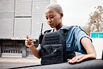 Black woman, drivers license or police officer in city to check info for law enforcement, protection or street safety. Cop, traffic stop or security guard on patrol for road block, crime or justice