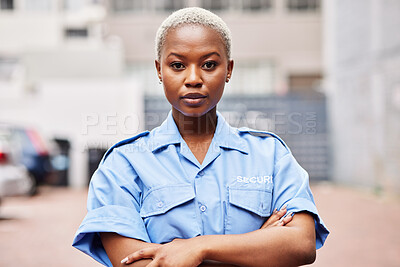 Buy stock photo Portrait, black woman and security guard with arms crossed for surveillance service, safety and urban watch. Law enforcement, bodyguard or serious female police officer in blue shirt for city patrol