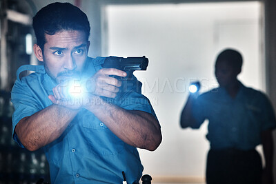 Buy stock photo Torch, police and man with gun for investigation, inspection and property search at night. Surveillance team, flashlight and security male person in dark room for safety, crime and protection service