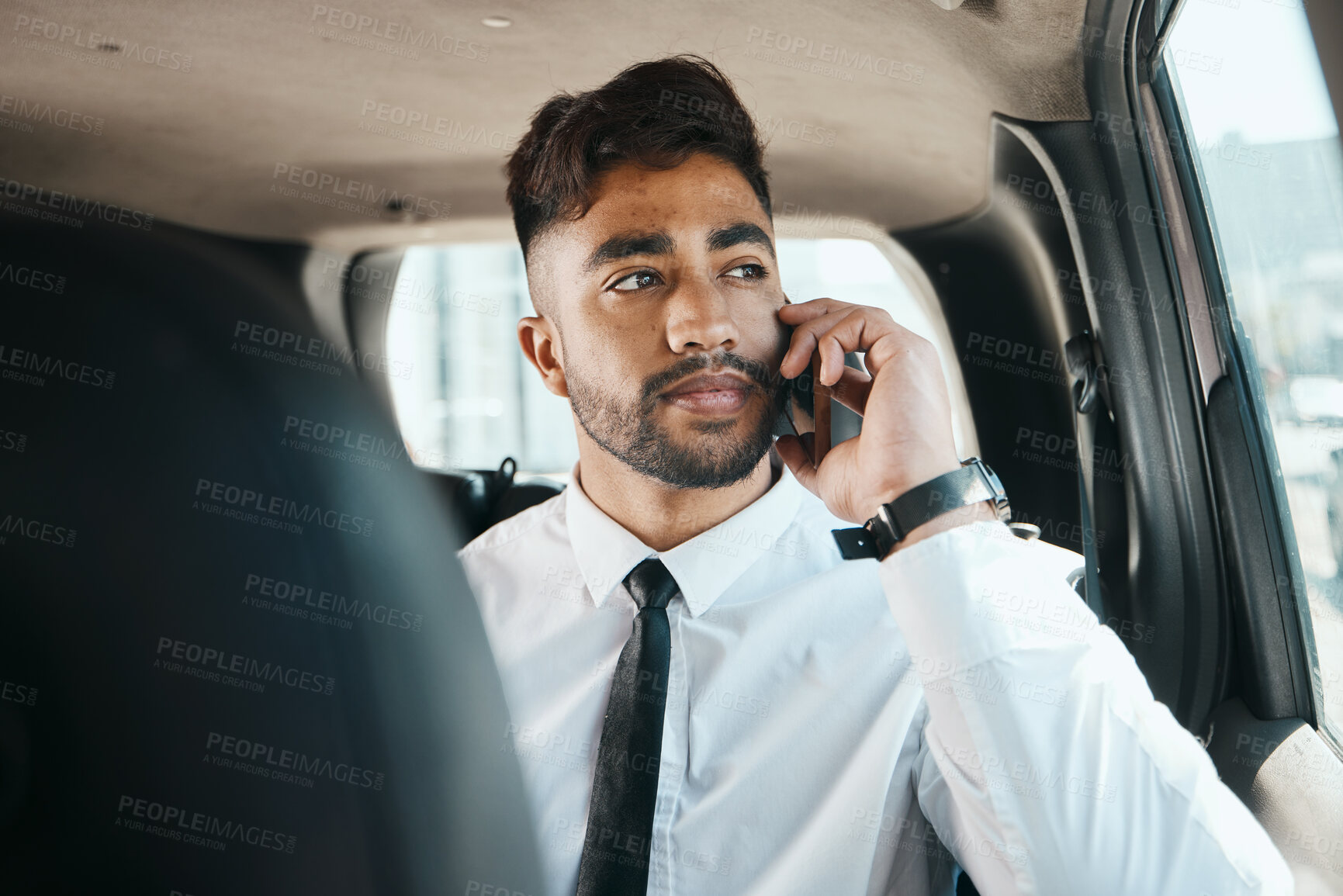 Buy stock photo Serious man, phone call and travel in business car for connection, mobile networking and journey. Indian male worker, thinking and talking to smartphone contact while driving in taxi transportation