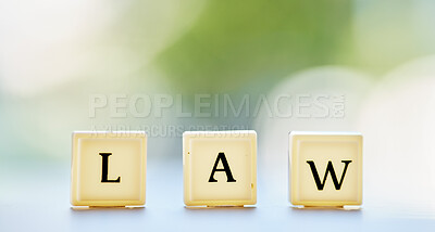 Buy stock photo Law letter, and table with block cubes in outdoor blur with mock up space for justice or attorney. Legal, alphabet and questions for support or services in brokeh background with regulation for help.