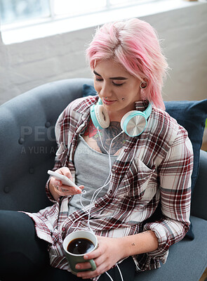 Buy stock photo Creative woman, student and phone for communication, social media or networking on sofa at home. Young female person chatting with coffee in relax on mobile smartphone app for streaming entertainment