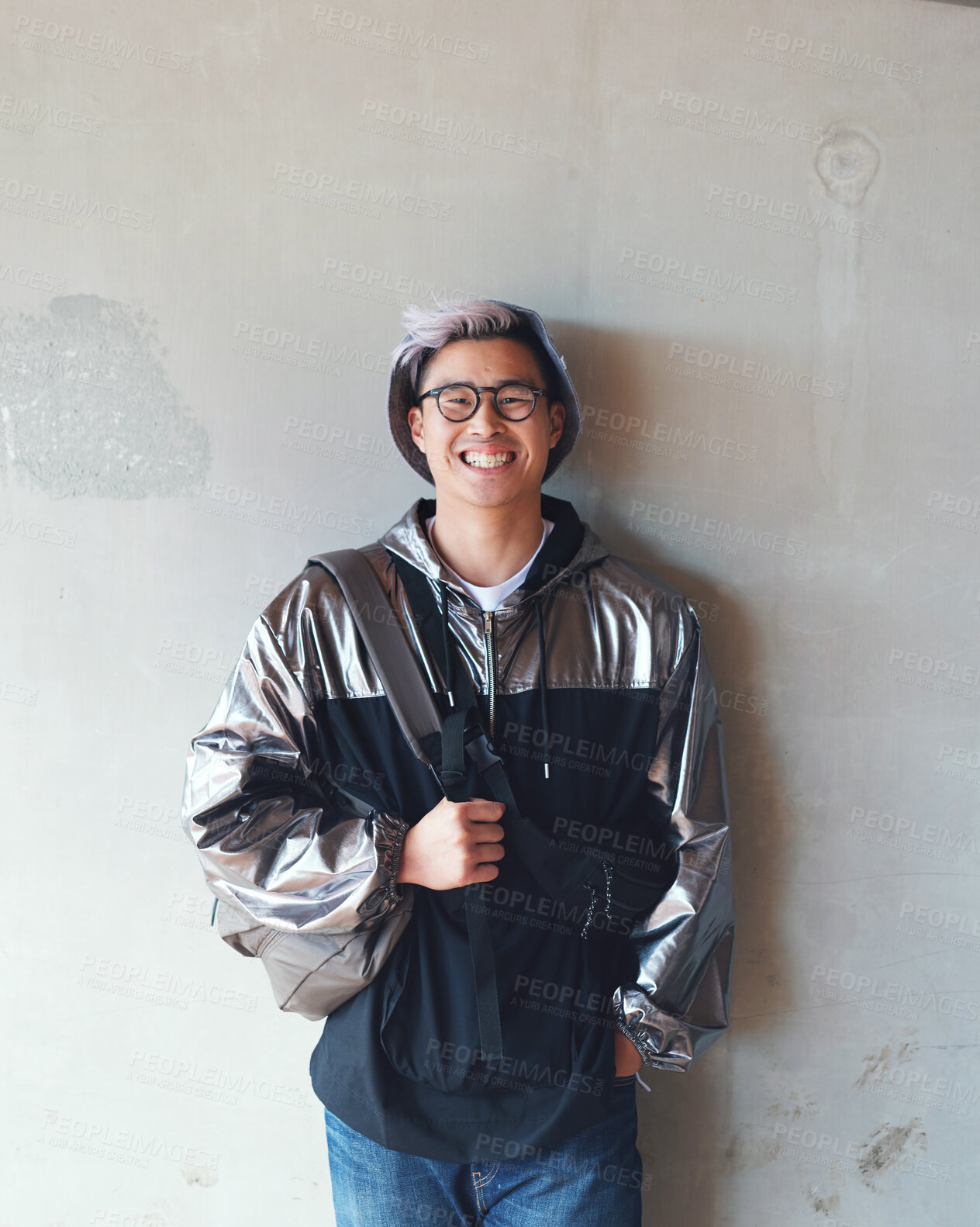 Buy stock photo Portrait, fashion and Asian man with a smile, streetwear and stylish outfit against a wall background. Male person, happy model and student with glasses, trendy clothes and happiness with confidence