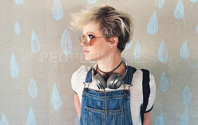 Buy stock photo Fashion, music and a gen z woman thinking in studio on a rain wallpaper background for trendy style. Cyberpunk, idea and headphones with an attractive young female person looking cool or edgy
