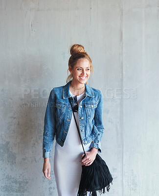 Buy stock photo Education, thinking and happy with a woman student leaning against a gray wall on the campus of her university. Scholarship, happy and idea with a young female pupil standing at college for learning