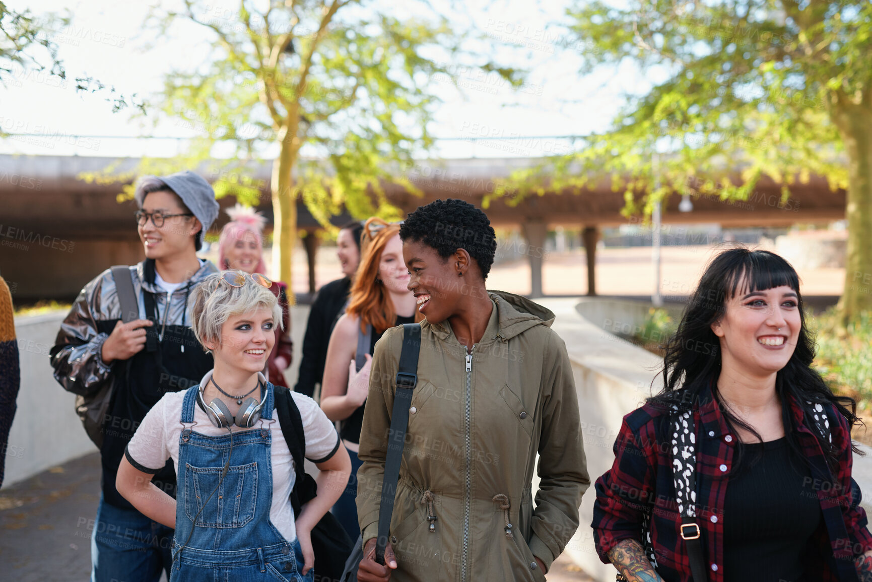 Buy stock photo College, campus and group of students walking at university talking and speaking with diversity ready for learning. Happy, education and young gen z people or friends with a scholarship together 