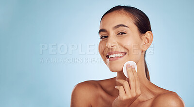 Buy stock photo Happy woman, portrait and cotton pad for skincare or makeup removal against a blue studio background. Female person or model smile with swab for cosmetics, foundation or facial treatment on mockup