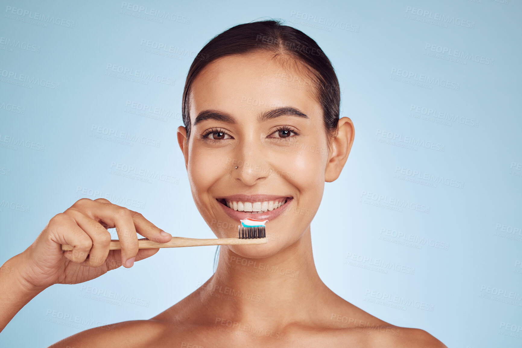 Buy stock photo Happy woman, portrait and toothbrush for dental care, health and wellness against a blue studio background. Female person smile with brush for cleaning teeth, oral mouth and gum hygiene in self love