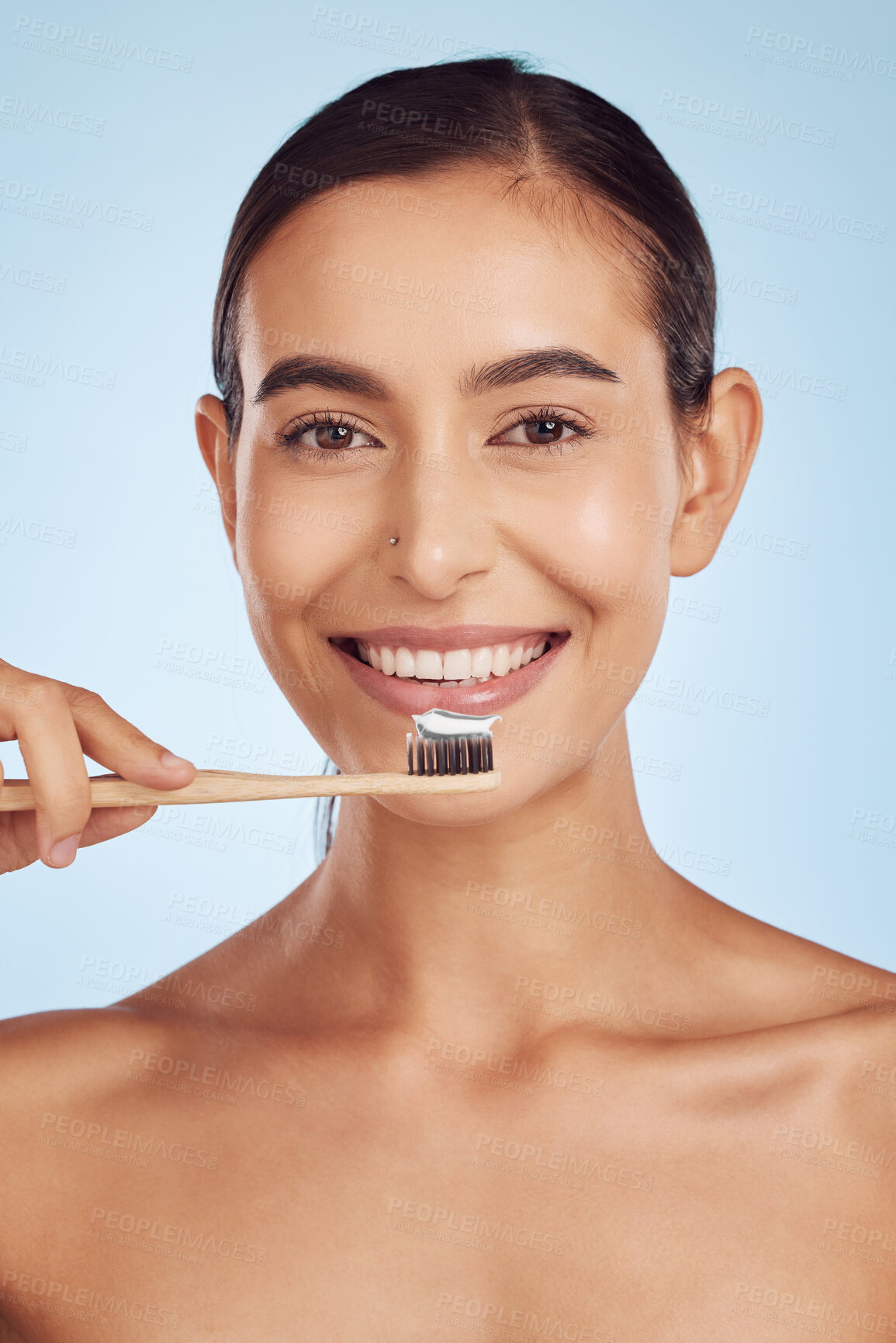 Buy stock photo Brushing teeth, portrait and woman with dental, hygiene and grooming with oral care isolated on blue background. Female model cleaning mouth, health and morning routine and toothbrush with toothpaste