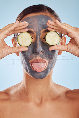 Buy stock photo Face mask, skincare and woman with beauty, cucumber and girl on a blue studio background. Portrait, female person and model with cosmetics, natural and aesthetic with hygiene, charcoal and self care