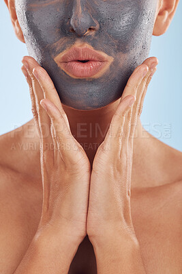 Buy stock photo Face mask, charcoal and beauty of woman with skincare facial treatment isolated in a blue studio background. Skin, cosmetic and young female person with clean, hydration and dermatology cream