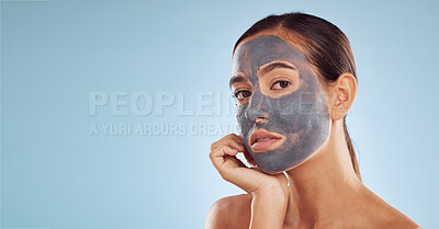 Buy stock photo Face mask, skincare and woman with beauty, mockup and girl on a blue studio background. Portrait, female person or model with cosmetics, charcoal or aesthetic with dermatology, hydration or self care