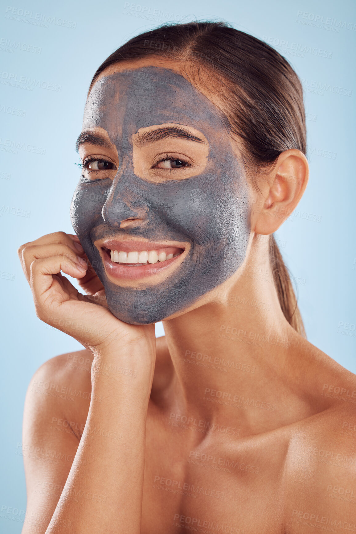 Buy stock photo Woman facial portrait and charcoal mask for beauty, skincare and natural cosmetics cleaning product on studio, blue background. Happy person or model in face collagen and mud skin care in dermatology