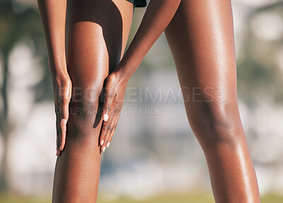 Buy stock photo Fitness, knee pain or injury and a sports woman outdoor with a medical emergency during cardio or endurance. Exercise, running and accident with a female runner holding her joint while training