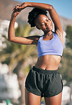 Fitness, health and stretching with a black woman runner outdoor on a blurred background for cardio or endurance training. Exercise, sports or running with a young athlete getting ready for a workout