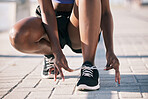 Hands, city and athlete tie shoes to start workout, training and exercise outdoor. Sports, fitness and person tying laces on sneakers to prepare for cardio, running and jog for health and wellness