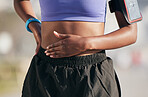Stomach, sports woman and pain from exercise injury, problem and first aid for fitness. Closeup, female athlete and hands on abdomen for emergency, muscle cramps and stress of sick, bellyache or risk