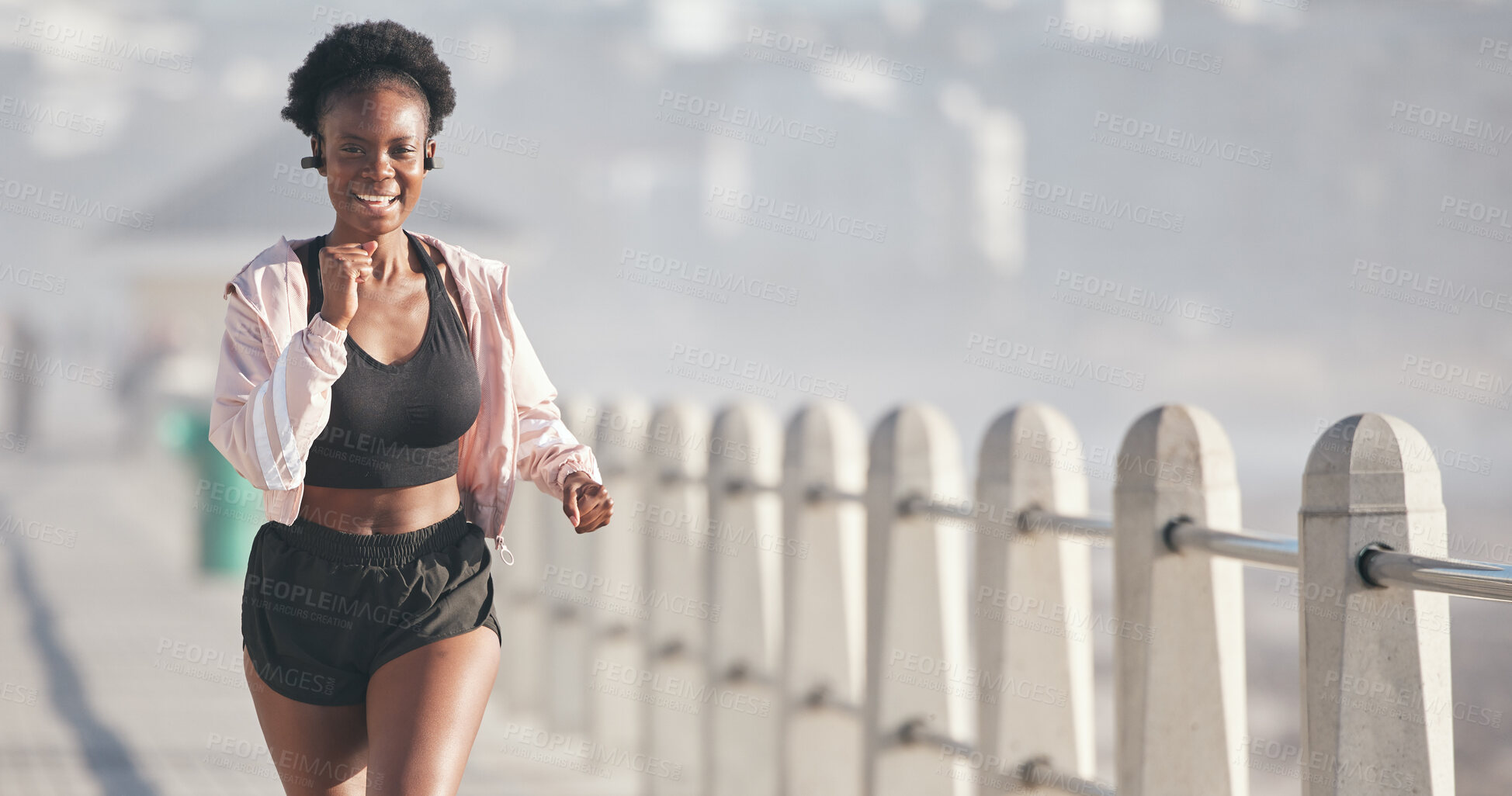 Buy stock photo Black woman, portrait and running outdoor with music earphones for audio, radio and podcast. Sports, fitness and happy African athlete training, workout and exercise for health, wellness or cardio