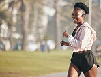 Black woman, fitness and running outdoor with earphones for listening to music, radio or podcast. Sports, smile and happy African athlete training, workout and exercise for health, wellness or cardio