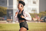 Black woman, smile and running outdoor with music earphones for listening to radio or podcast. Fitness, sports and happy African athlete training, workout and exercise for health, wellness or cardio