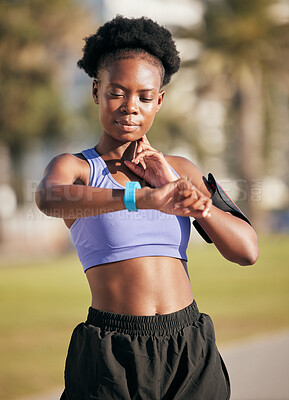 Buy stock photo Fitness, pulse and female athlete on a workout with smartwatch for running outdoor in nature. Sports, exercise and African woman monitoring her heart rate for cardio training for race or marathon.