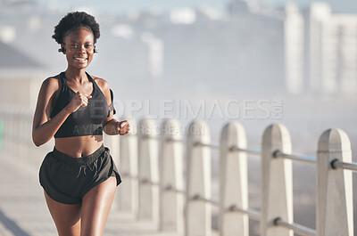 Buy stock photo Sports, running and black woman outdoor with music earphones for audio, radio sound and podcast. Smile, fitness and happy African athlete training, workout and exercise for health, wellness or cardio