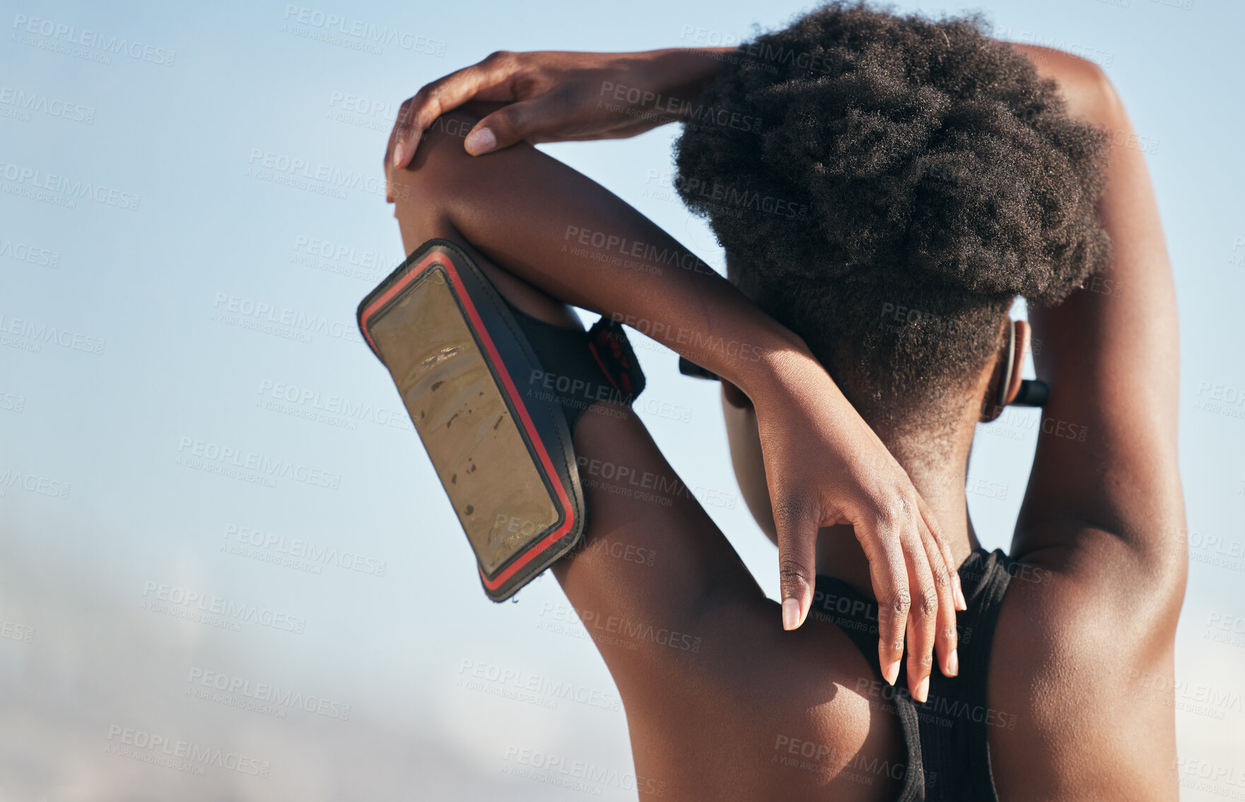 Buy stock photo Sports, stretching back and woman for outdoor running, cardio wellness and exercise or workout with phone health. Biometric, mobile and fitness person or runner warm up or training in nature blue sky