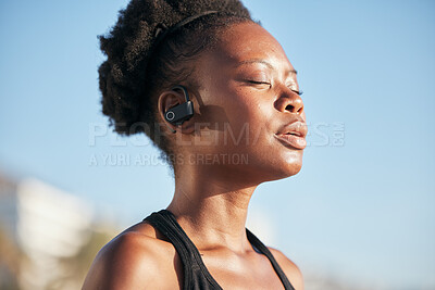 Buy stock photo Black woman, runner and thinking with headphones in city, outdoor or tired with fitness, health or music. African girl, running or listen with eyes closed, streaming or mindset with fatigue in summer