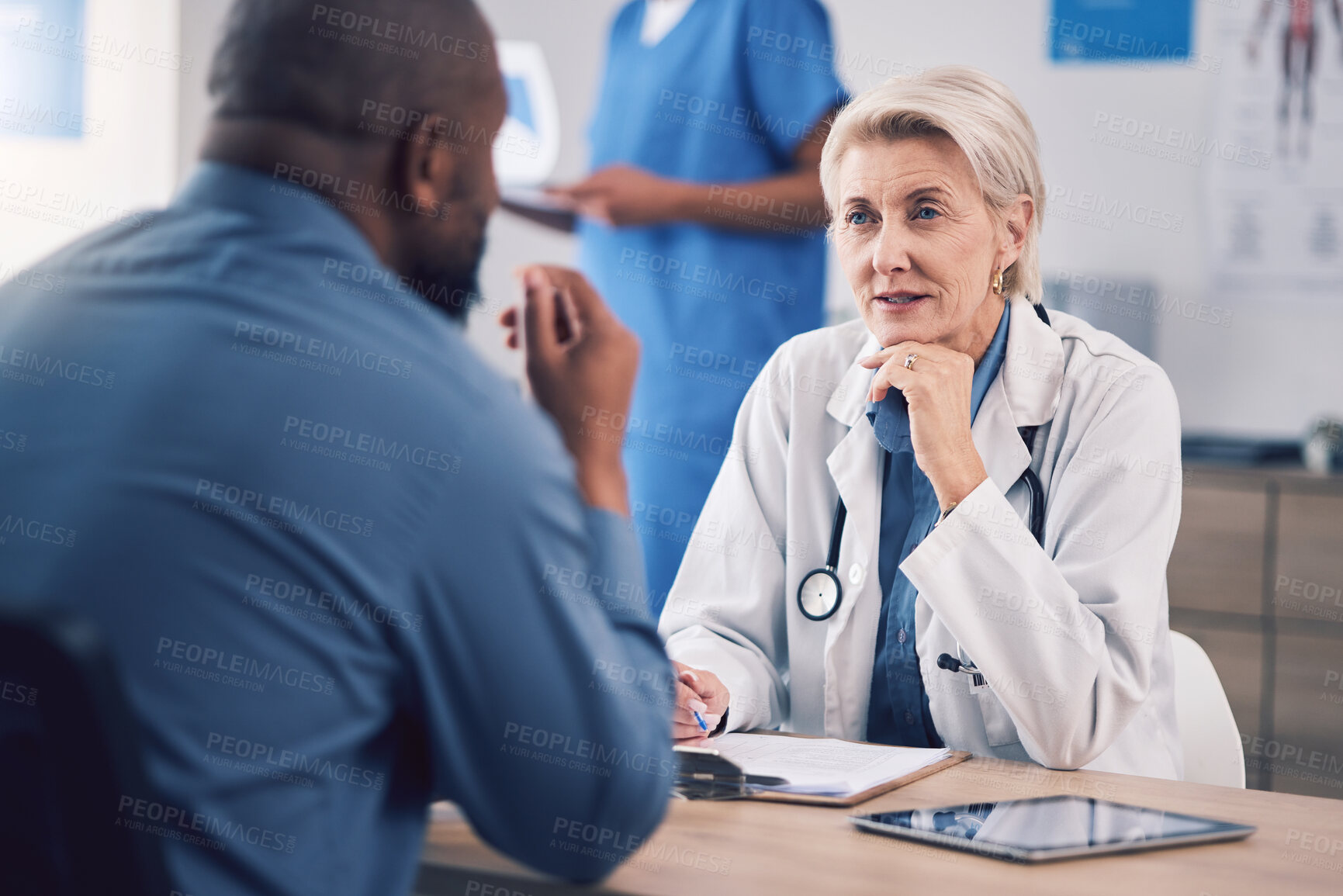 Buy stock photo Woman, doctor and talking to patient in consultation for healthcare advice, clinic services and support. Mature medical professional consulting man in hospital for analysis, feedback and test results