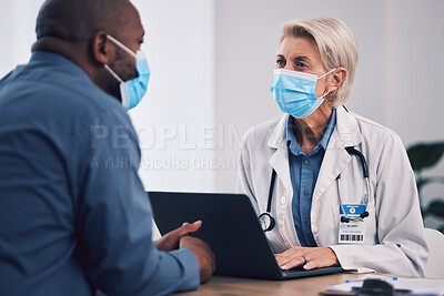 Buy stock photo Woman, doctor and laptop with patient in consultation, checkup or help and advice at hospital. Female person, medical or healthcare expert with face mask consulting customer with technology at clinic