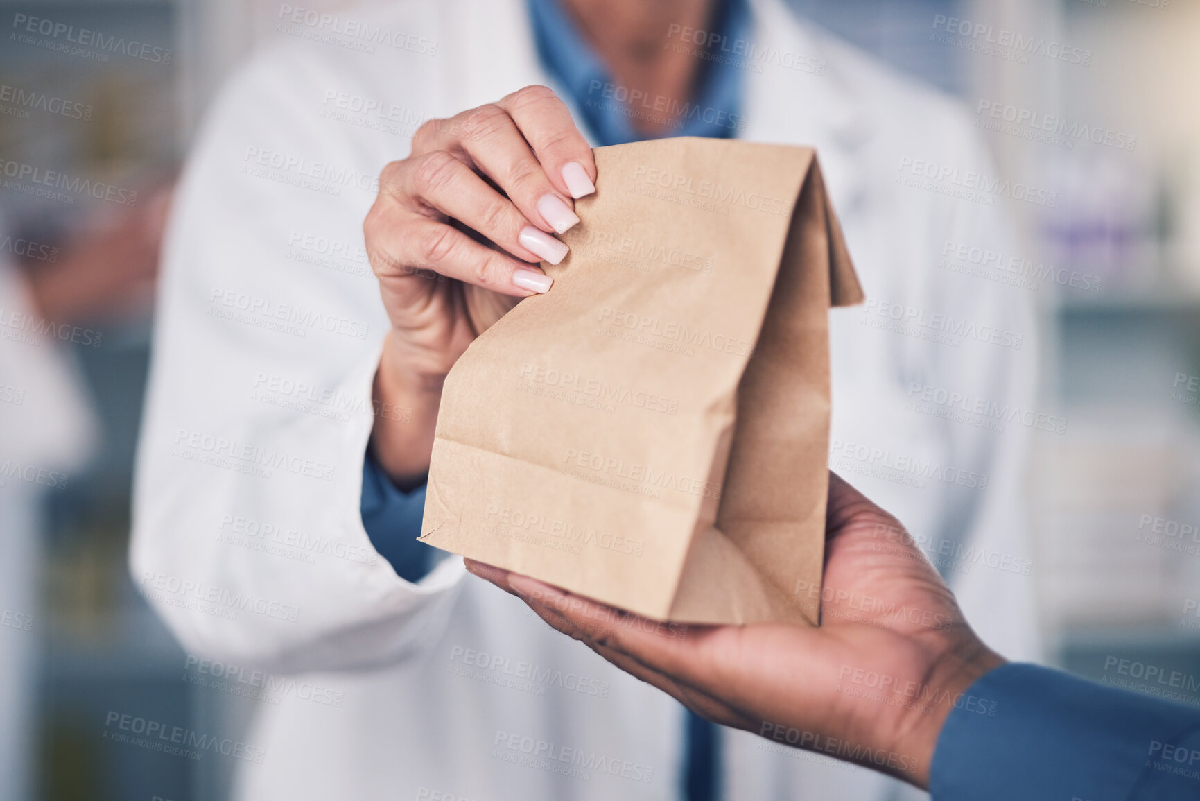 Buy stock photo Woman, pharmacist and hands with paper bag for patient, healthcare or medication at the pharmacy. Closeup of female person or medical professional giving pills, drugs or pharmaceuticals to customer