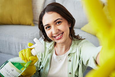 Buy stock photo Woman, selfie and spray for cleaning home, portrait or smile in gloves, social media and chemical. Happy influencer girl, photography and profile picture with product to stop bacteria in living room