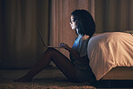 Bed, laptop and woman typing at night for website, online social media and remote work in home. Bedroom, computer and person streaming movie, film and video on pc technology with insomnia in house.