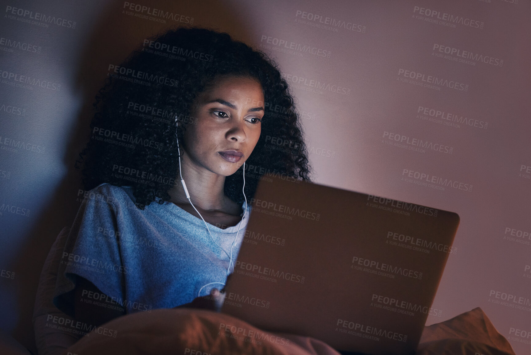 Buy stock photo Laptop, bedroom and woman with music at night for radio, podcast sound and online social media in home. Bed, computer and person with earphones streaming movie, film and video on tech with insomnia