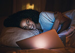 Laptop, happy and woman on bed at night for website, online social media and relax in home. Bedroom, computer and person streaming movie, internet film and video on technology with insomnia in house.