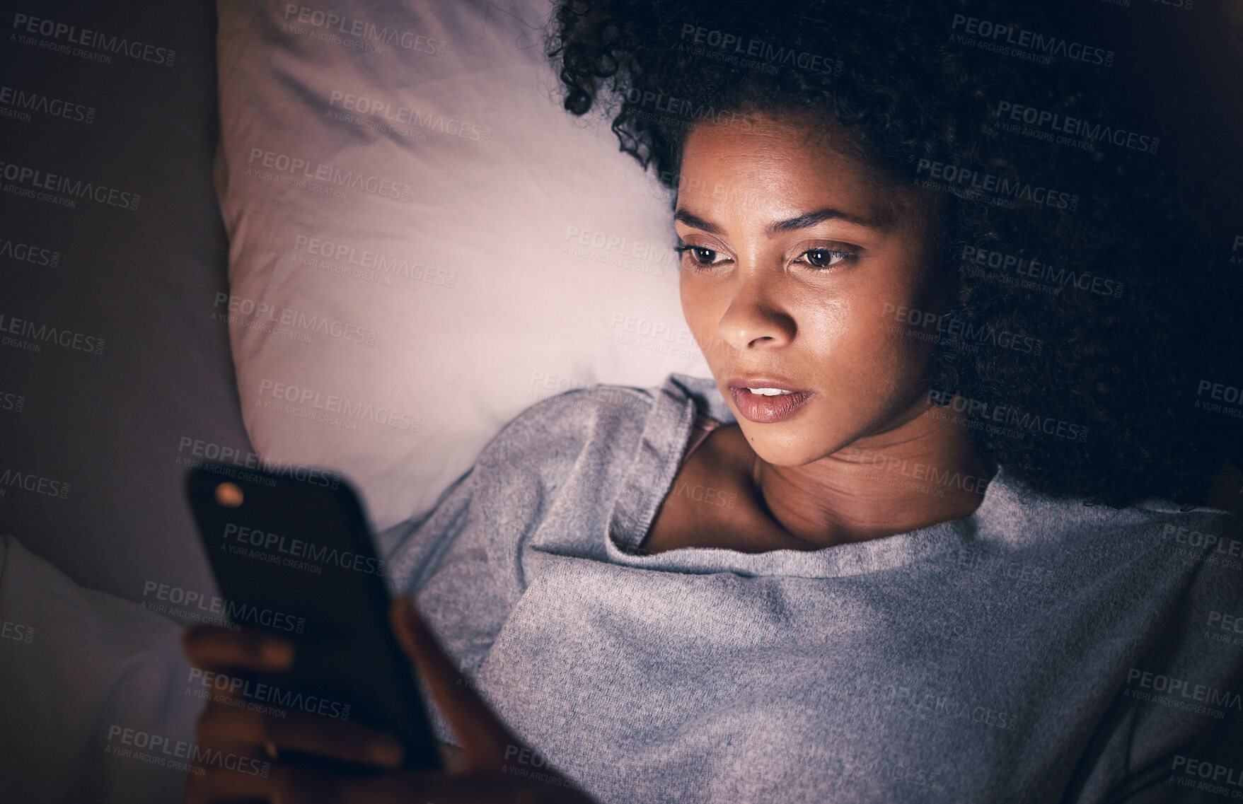 Buy stock photo Sad, night and phone with woman in bedroom for social media app, insomnia and networking. Communication, contact and internet with female person in bed at home for mobile, online and technology