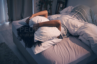 Buy stock photo Bedroom, insomnia and woman with pillow on face, tired and frustrated with stress, nightmare or dream. Fatigue, sleep problem and exhausted girl in bed with fear, scared at night and crisis in home.