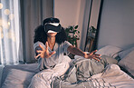 Woman, bed and vr game in night, home and online in metaverse, matrix and stretching hands for challenge. Girl, augmented reality glasses and vision for 3d user experience, dark bedroom and apartment