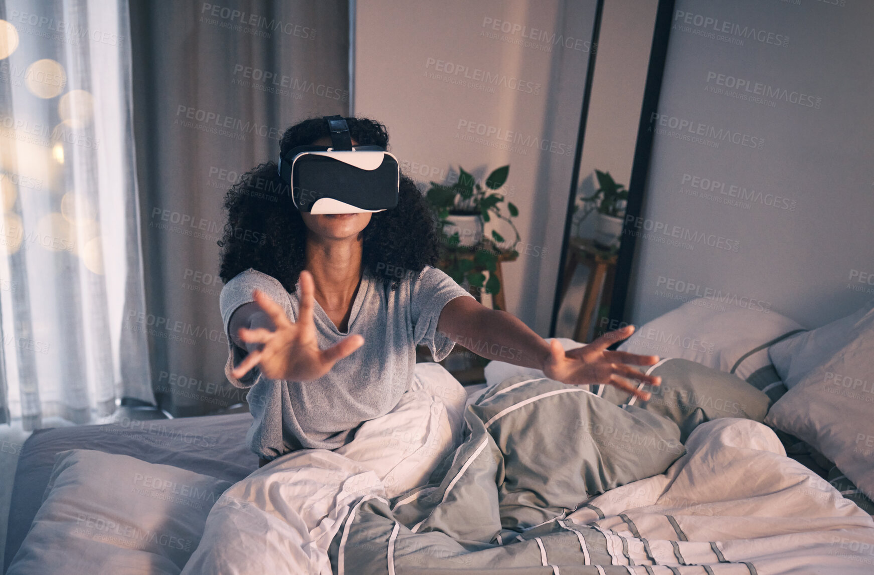 Buy stock photo Woman, bed and vr game in night, home and online in metaverse, matrix and stretching hands for challenge. Girl, augmented reality glasses and vision for 3d user experience, dark bedroom and apartment