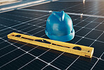 Solar panel, tools and helmet for renewable energy isolated for maintenance and construction. Above view, sustainability and engineer equipment on a rooftop for eco friendly power project and safety