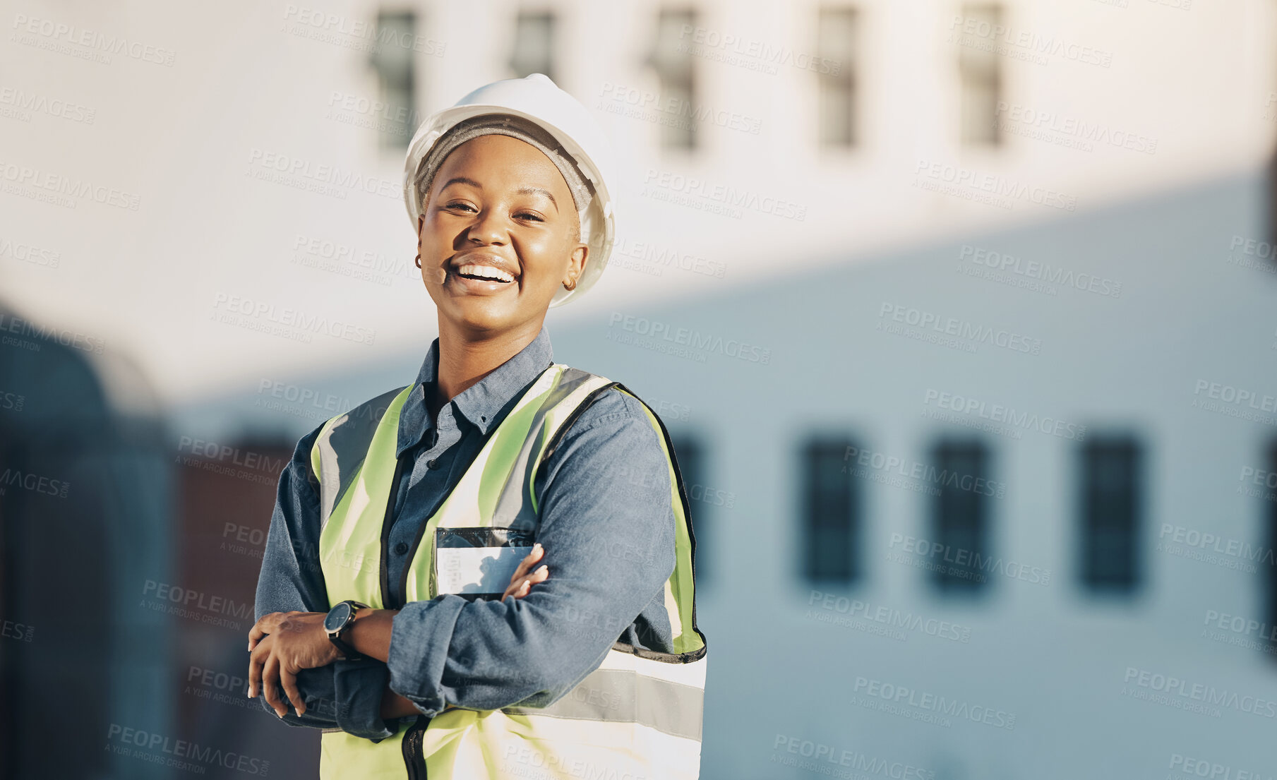 Buy stock photo Woman, construction worker and arms crossed portrait with a smile for engineering and building renovation job. Happy and African female employee on a industrial site outdoor for builder project