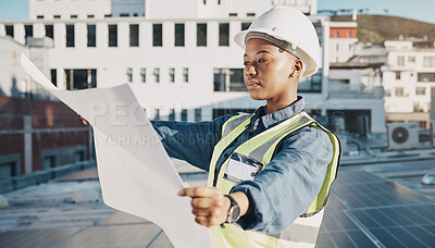 Buy stock photo Female engineer, solar panel blueprint or outdoor on rooftop for power, sustainability plan or energy development. Black woman, photovoltaic tech or reading on roof, analysis or illustration in metro