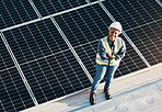 Woman, solar panel construction and arms crossed portrait with a smile for engineering and green energy. Labor, happy and African female employee on industrial site outdoor for eco project from above