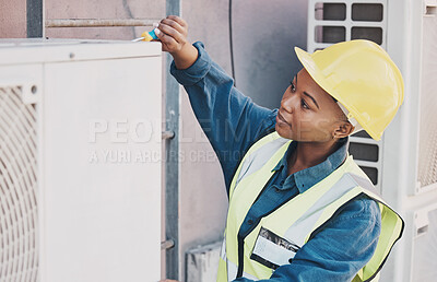 Buy stock photo Black woman, technician and building installation for solar panel, construction or vent on roof. African female person, contractor or engineer installing industrial equipment for architecture in city