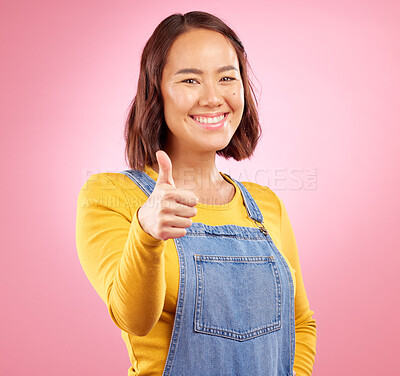 Buy stock photo Smile, thumbs up and yes with portrait of woman in studio for support, agreement and motivation. Winner, emoji and success with person on pink background for achievement, thank you and vote sign