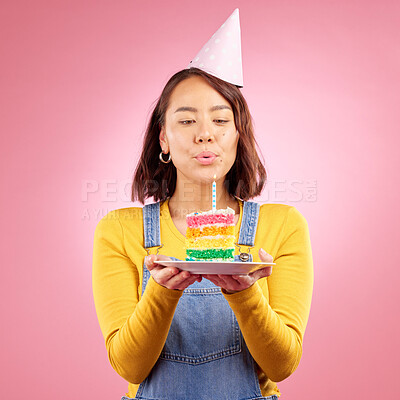 Buy stock photo Birthday cake, studio and Asian woman blow candle, fire or flame for celebration party, present or event gift. Congratulations, wish and Japanese person with dessert, candy or food on pink background