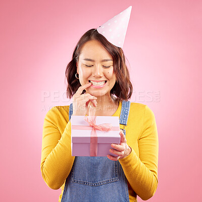 Buy stock photo Birthday present, box and curious Asian woman excited, smile and celebrate party, studio prize or gift. Secret surprise, wonder and Japanese person with mystery event package on pink background