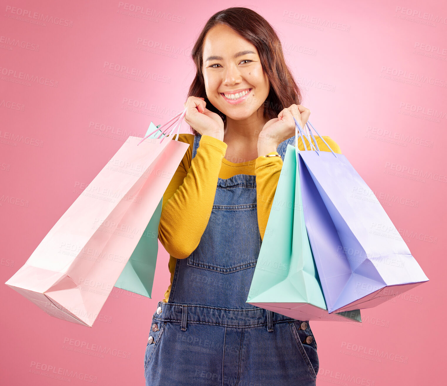 Buy stock photo Smile, shopping bag and sale with portrait of woman in studio for discount, fashion and deal. Product, retail and luxury with a happy female customer on pink background for market, mall and store