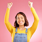 Smile, celebration and success with portrait of woman in studio for party, winner and motivation. Wow, freedom and prize with face of person cheering in pink background for yes, bonus and excited